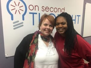 Alison Law and Nicki Salcedo stand in front of banner reading On Second Thought