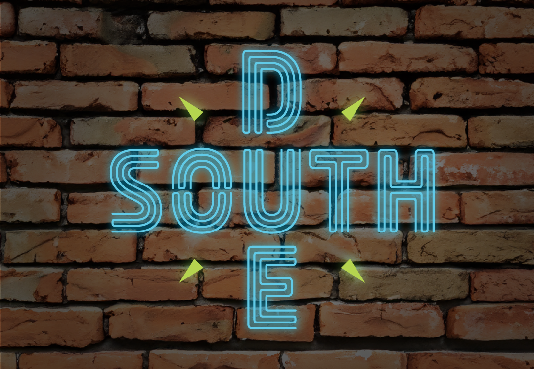 Due South logo on brick wall. Due South is a show produced by WUNC, North Carolina Public Radio.